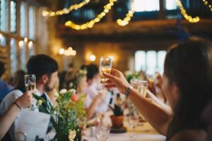 Uses of beermats; People raising their glasses to a toast in a wedding