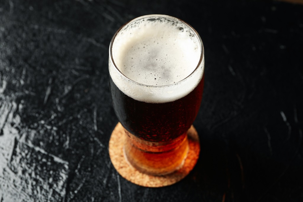 Carbon balanced, beer glass on a beer mat.